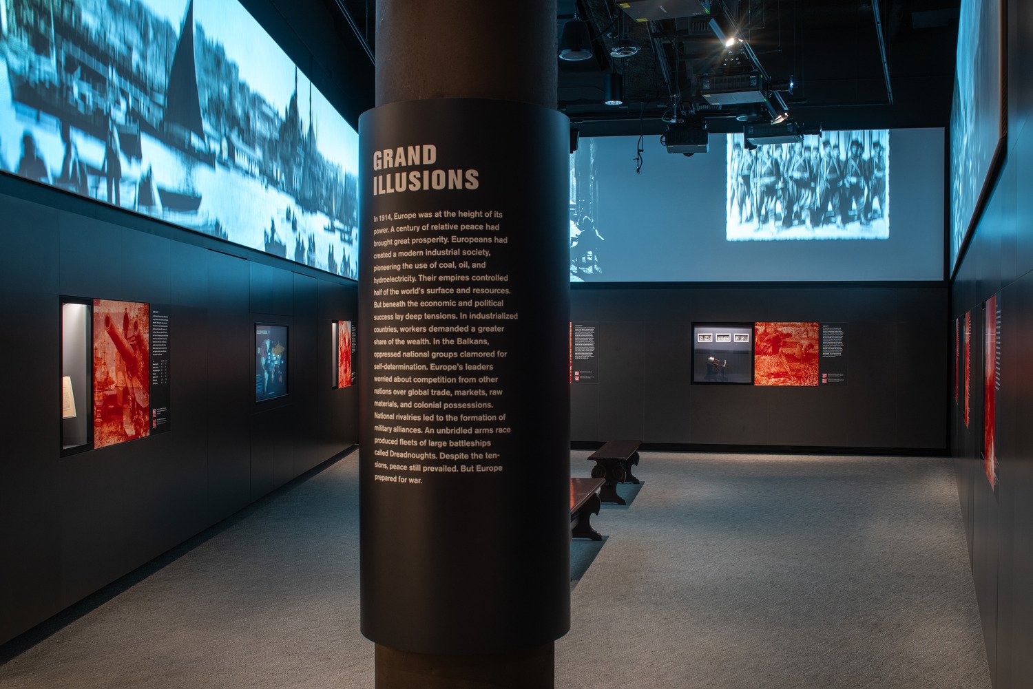 A beam that has the information of the exhibit on it with media projected around it.