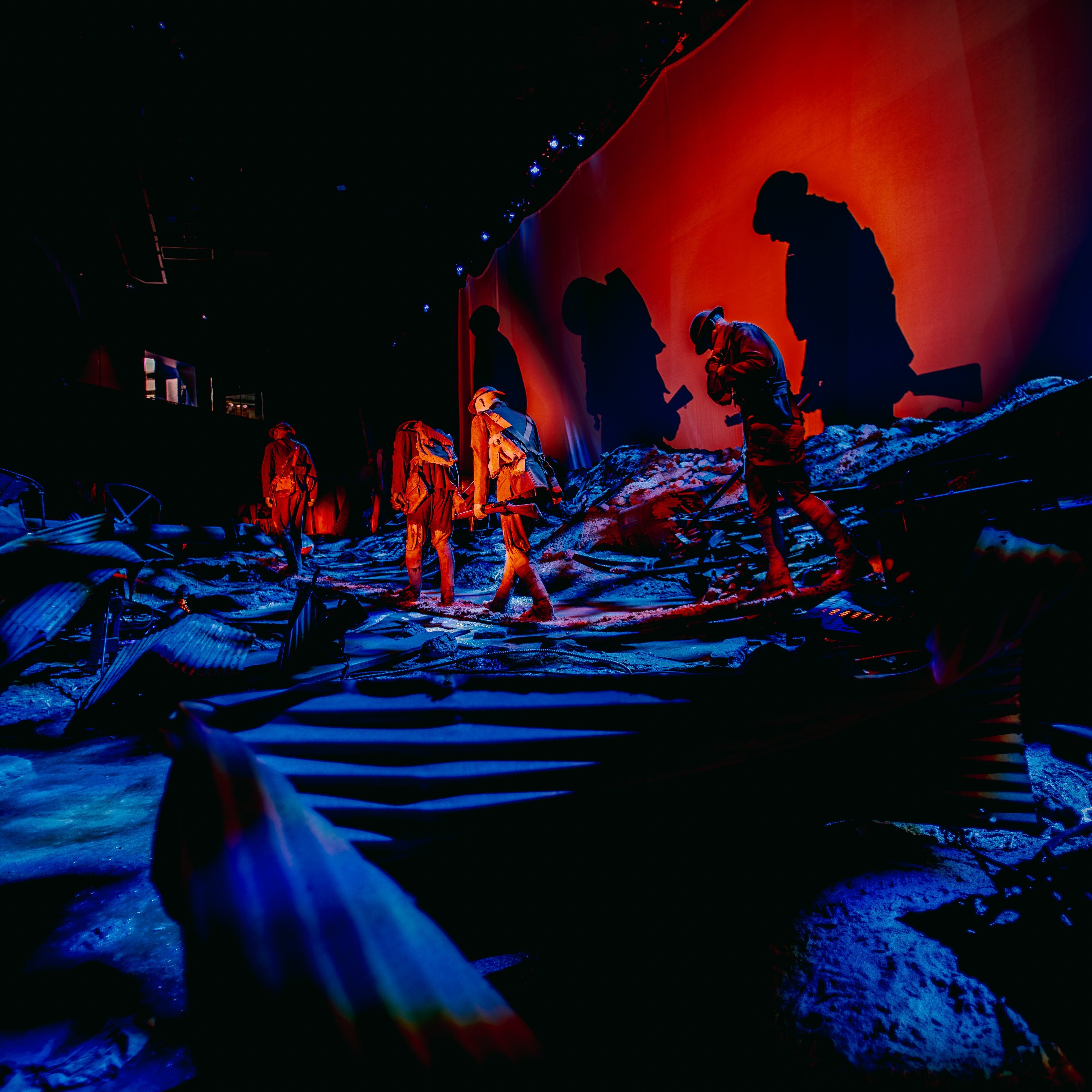 Soldiers' reenactment trudging through a muddy environment with a over casted shadow.