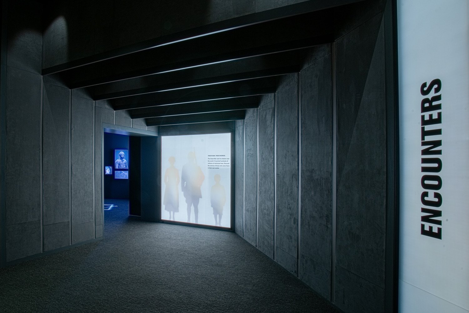 The entrance to the Encounters exhibit with a large video wall.