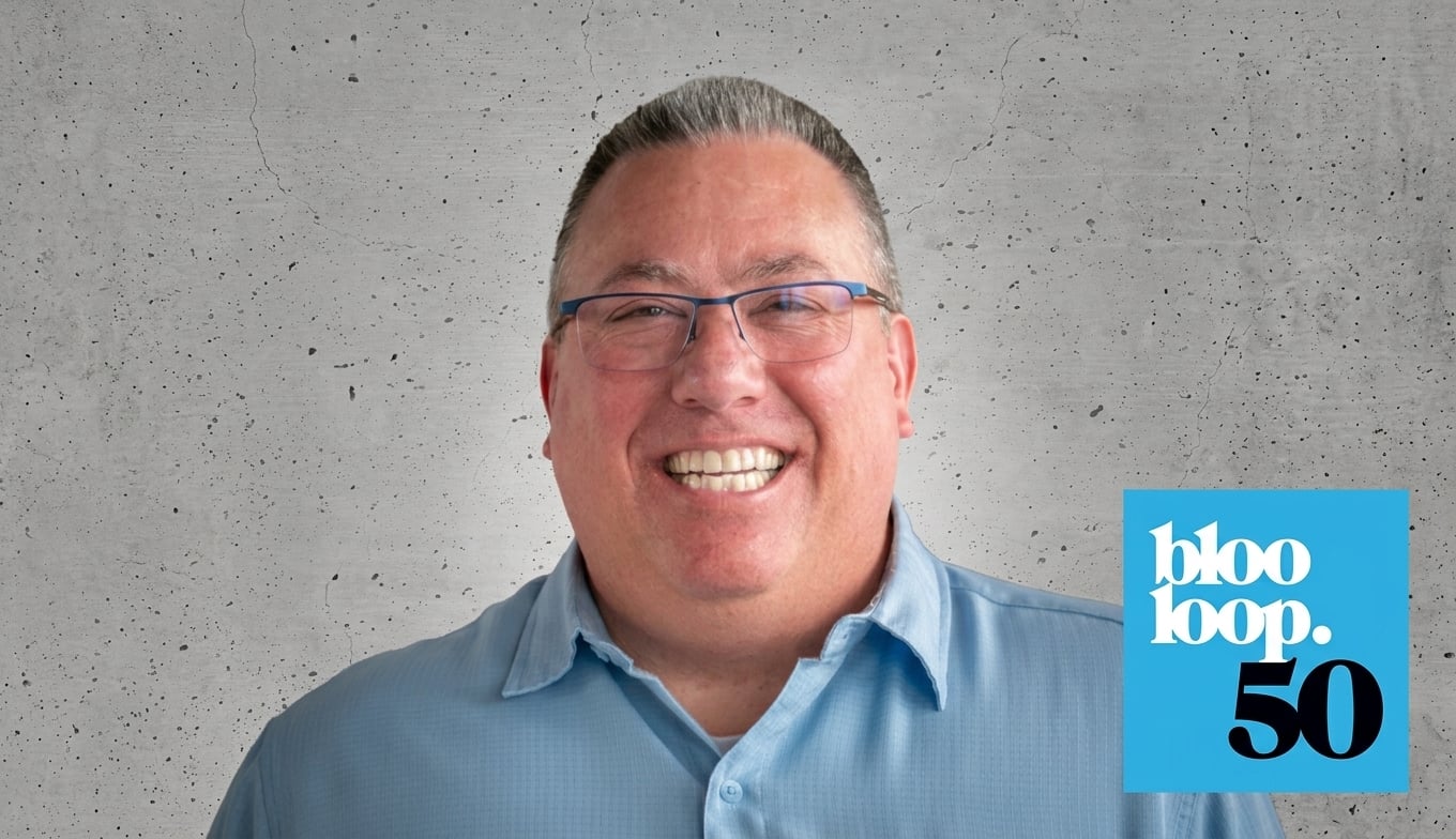 Headshot of Chris Johnson of Electrosonic smiling next to the blooloop top 50 logo.
